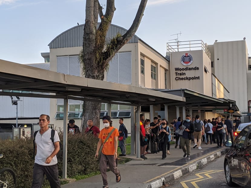 People streaming across the Woodlands Checkpoint into Singapore on March 17, 2020, the morning after Malaysia announced a nationwide lockdown. People streaming across the Woodlands Checkpoint into Singapore on March 17, 2020, the morning after Malaysia announced a nationwide lockdown.