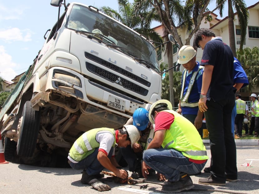 Truck sinks into ground along Upper Changi Road East