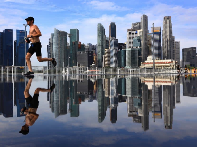 A man jogging within the business district of Singapore in February 2022. A man jogging within the business district of Singapore in February 2022.