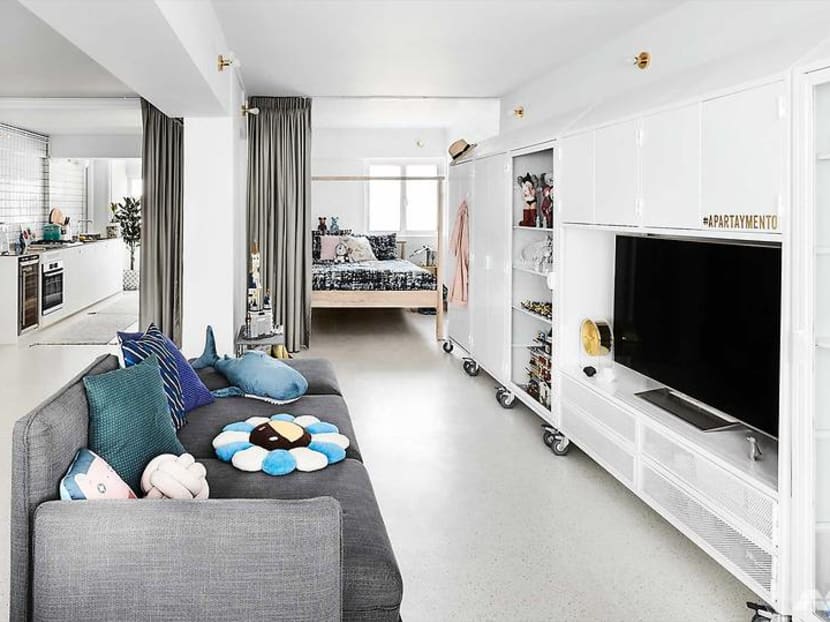 How a 732 sq ft open-plan HDB home uses mobile furniture for a new layout every time