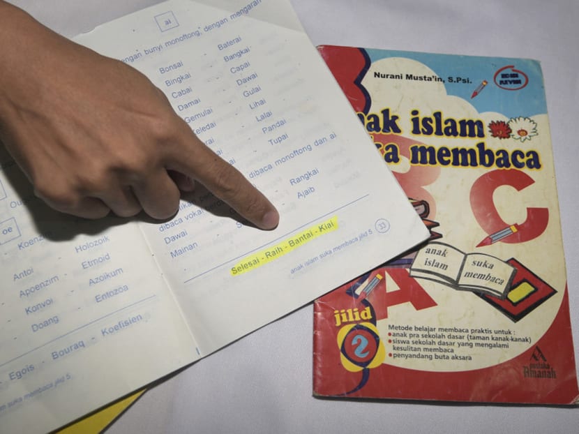 Members of the GP Ansor group uncovered the textbooks in Depok, West Java. Photo: Jakarta Globe