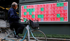 Asia stocks tumble from record highs on profit taking; dollar gains