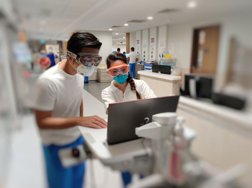 Dr Puah Ser Hon (left), a respiratory physician, and Ms Emelin Tan (right), a senior respiratory therapist, in a ward at the National Centre for Infectious Diseases. Dr Puah Ser Hon (left), a respiratory physician, and Ms Emelin Tan (right), a senior respiratory therapist, in a ward at the National Centre for Infectious Diseases.