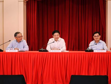 Prime Minister-designate Lawrence Wong (centre), flanked by his chosen deputies Gan Kim Yong (left) and Heng Swee Keat, at a press conference to announce his new Cabinet line-up on May 13, 2024.