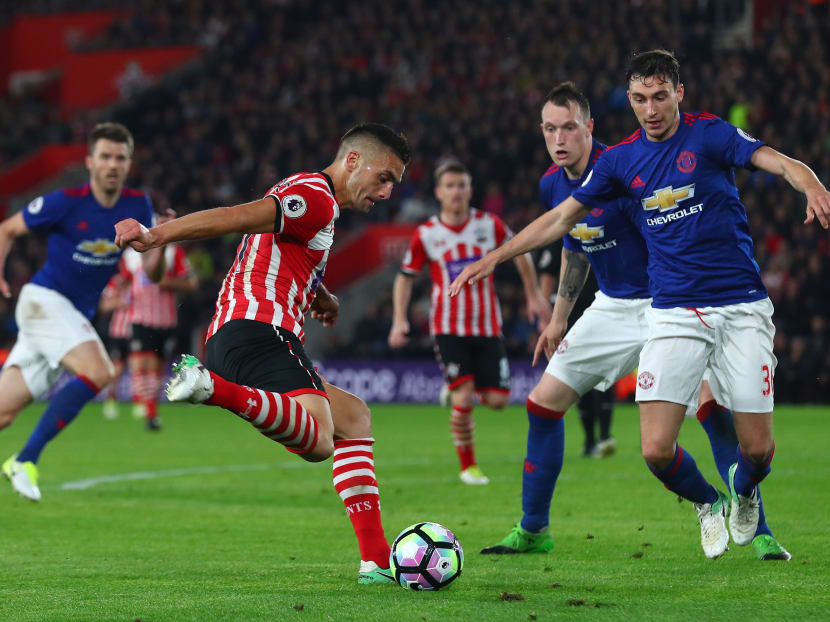 Dusan Tadic of Southampton shoots as Matteo Darmian of Manchester United attempts to block during the Premier League match between Southampton and Manchester United at St Mary's Stadium on May 17, 2017 in Southampton, England. Photo: Getty Images