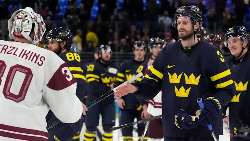 Ice hockey-Sweden beat Latvia to set men's quarter-final meeting with US
