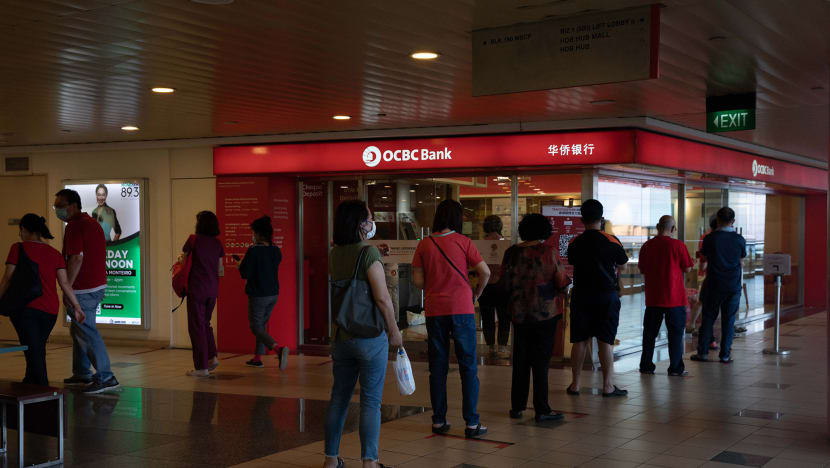 Seeking good luck, some Singaporeans deposit cash in person on Li Chun, others transfer money online