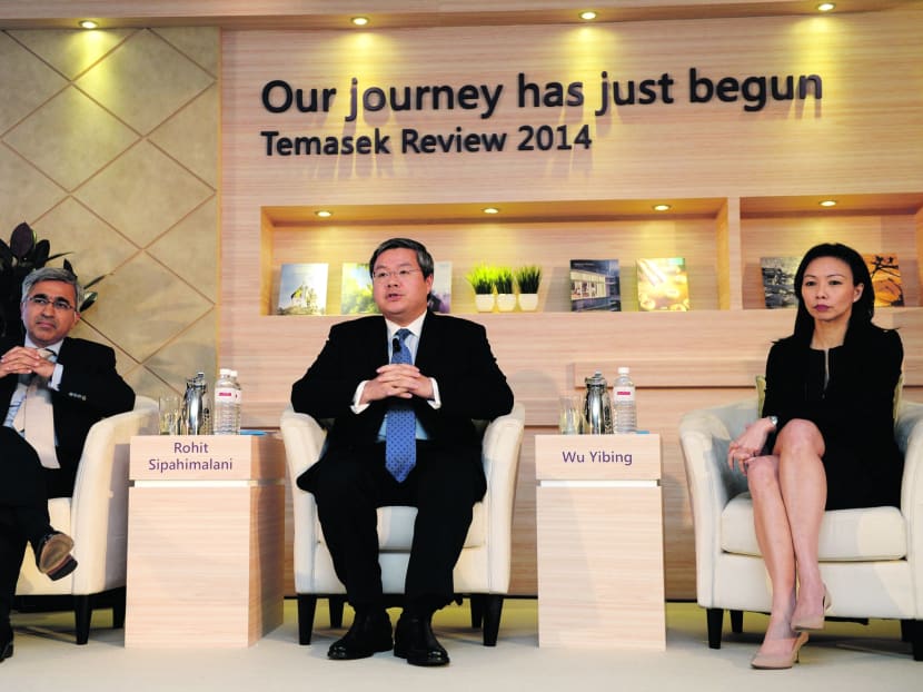 (From left) Temasek’s Rohit Sipahimalani, co-head of investment and Middle East and head of India, Wu Yibing, head of China, and Pek Siok Lan, senior managing director of general counsel and investment, at the launch of the Temasek Review 2014 yesterday. Photo: Temasek