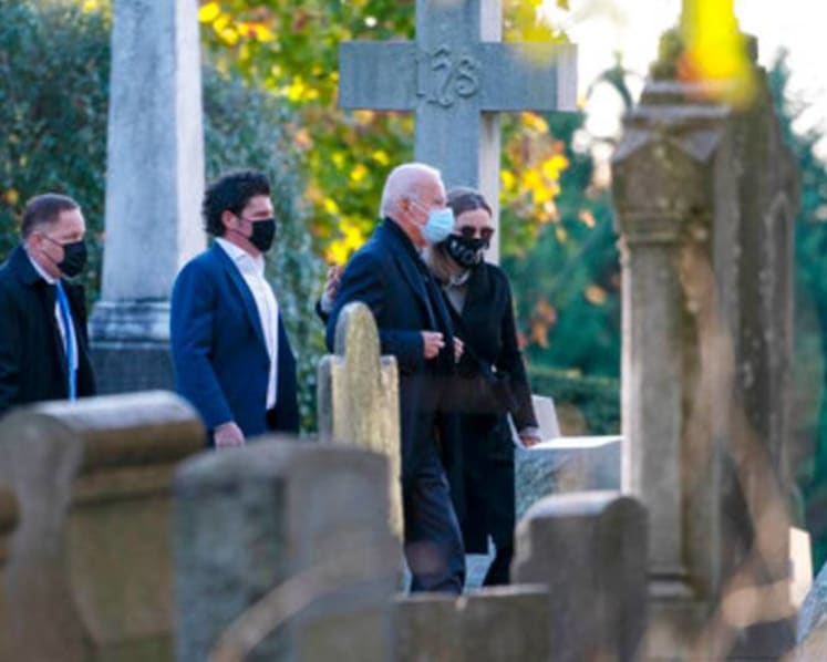 Biden begins US election day visiting son's grave