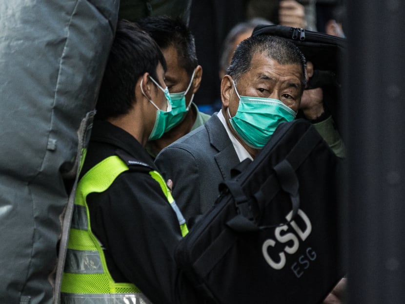 Media tycoon Jimmy Lai (right) is escorted into a Hong Kong Correctional Services van outside the Court of Final Appeal in Hong Kong on Feb 1, 2021, after being ordered to remain in jail while judges consider his fresh bail application, the first major legal challenge to a sweeping national security law Beijing imposed on the city last year. Media tycoon Jimmy Lai (right) is escorted into a Hong Kong Correctional Services van outside the Court of Final Appeal in Hong Kong on Feb 1, 2021, after being ordered to remain in jail while judges consider his fresh bail application, the first major legal challenge to a sweeping national security law Beijing imposed on the city last year.