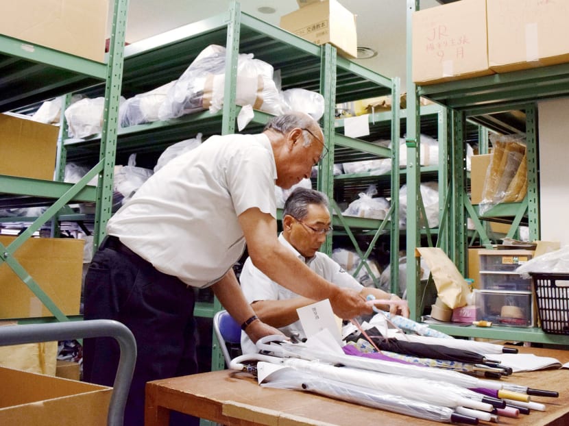 Workers sort out umbrellas at a lost-and-found office in Sapporo, Japan. The number of lost items taken to police stations nationwide jumped to around 27.96 million in 2016 from about 12.72 million in 2007, according to the National Police Agency. Photo: Kyodo