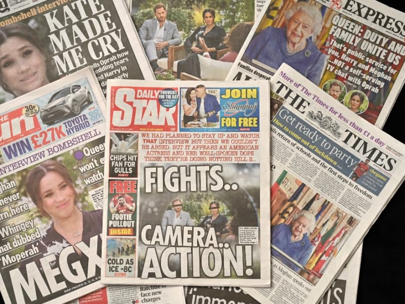 An arrangement of UK daily newspapers photographed as an illustration in Brighton on March 8, 2021, shows front page headlines reporting on the story of the interview given by Meghan, Duchess of Sussex, wife of Britain's Prince Harry, Duke of Sussex, to Oprah Winfrey, which aired on US broadcaster CBS.