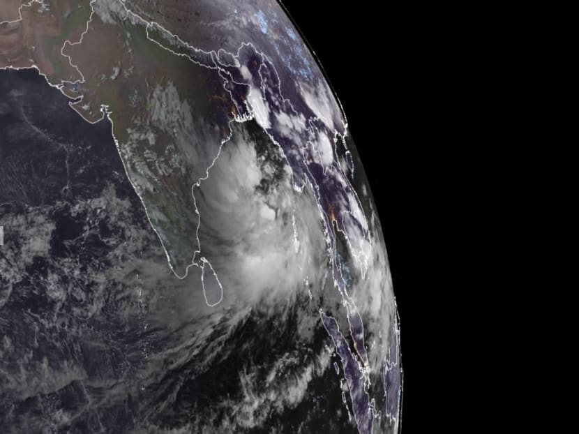 A cyclone (right) is seen approaching eastern India on May 23, 2021.