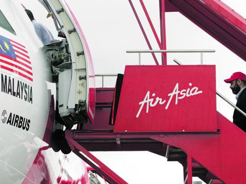 A passenger boarding an AirAsia flight. Photo: Don Wong