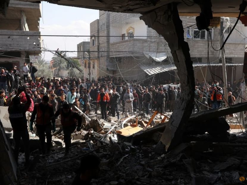 Palestinians gather at the site of an Israeli strike on a house, amid the ongoing conflict between Israel and Hamas, in Rafah, in the southern Gaza Strip on Feb 24, 2024. Palestinians gather at the site of an Israeli strike on a house, amid the ongoing conflict between Israel and Hamas, in Rafah, in the southern Gaza Strip on Feb 24, 2024.