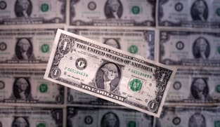 Dollar clings to gains with focus on Fed policy as French politics cloud euro