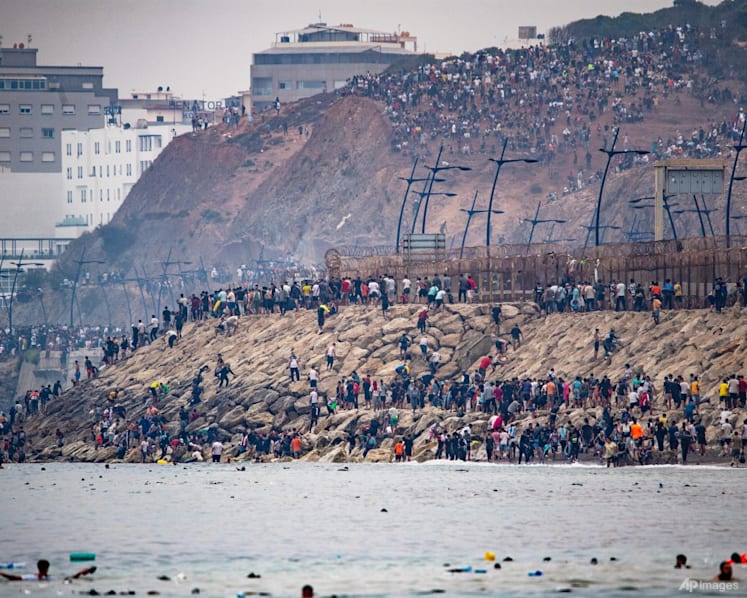 Spain says migrants are returning from Ceuta after 57 die in border rush