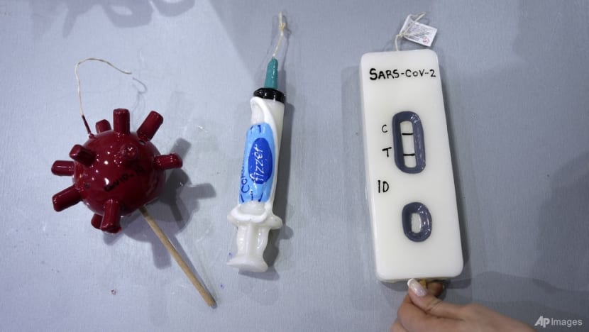 COVID-themed candles on sale in Greece for Orthodox Easter