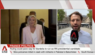 French appeal court upholds Le Pen's conviction but shortens her ban from office