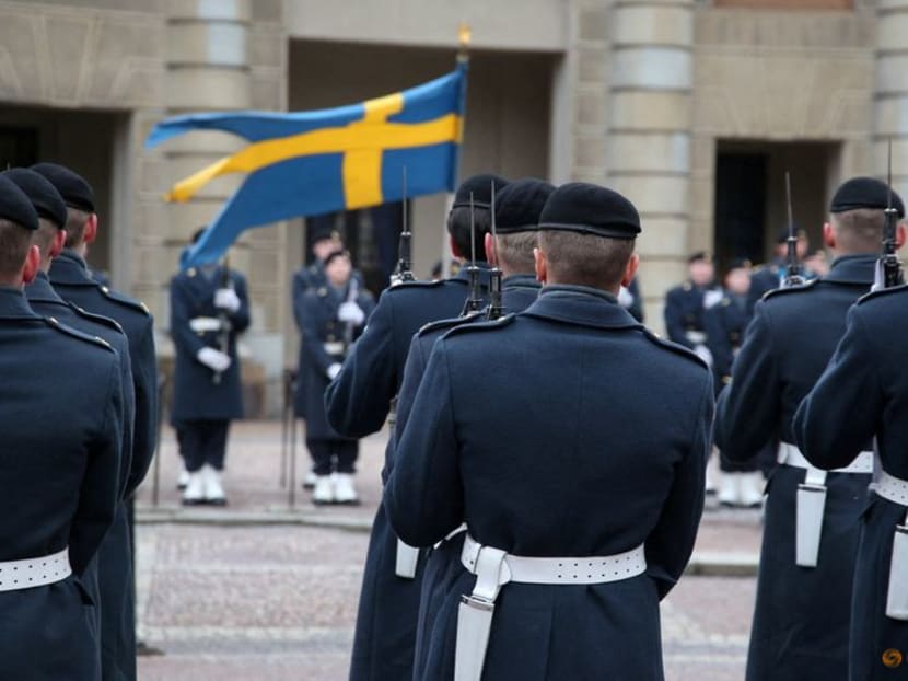 Swedish soldiers take part in the changing of the guard ceremony in the courtyard of the Royal Palace in Stockholm, Sweden, on Feb 24, 2024.
