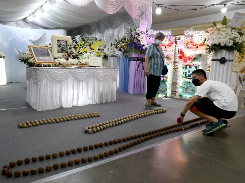 Madam Hew Lin Yin, 77, and Oh Wei Heng, 17, who are the wife and grandson of the late Oh Ow Kee, at his funeral wake on June 8, 2022. 