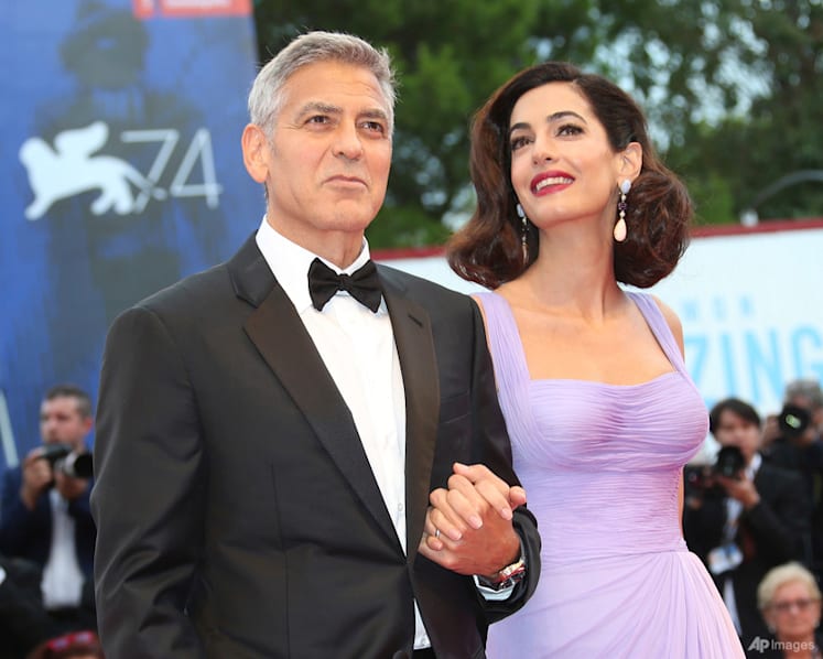 George Clooney, his wife Amal and children become French