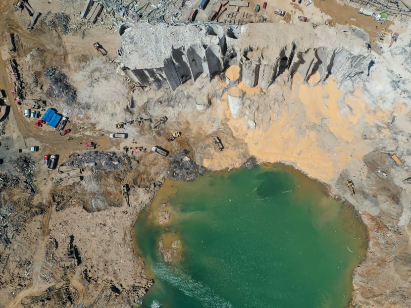An aerial view taken on Aug 9, 2020, shows a general view of the port of Beirut, the damaged grain silo and the crater caused by the colossal explosion of a huge pile of ammonium nitrate that had languished for years in a port warehouse, leaving scores of people dead or injured and causing devastation in the Lebanese capital.