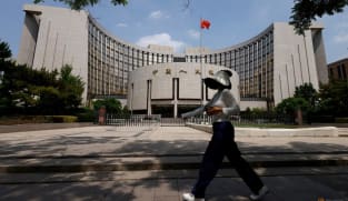 China's central bank cuts two key rates to historic lows as trade war simmers