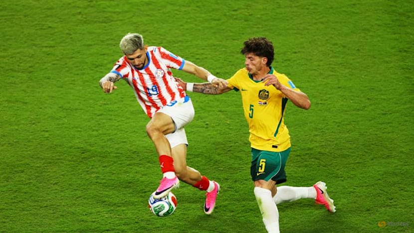 Australia reach World Cup knockouts after goalless draw with Paraguay