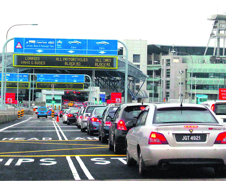 Man who drove through Tuas Checkpoint charged in court