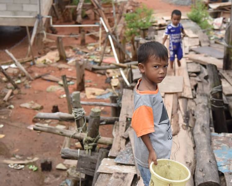 ‘My son dreamt of becoming a soldier’: COVID-19 takes a toll on Indonesian children