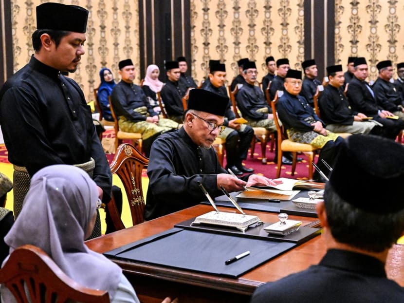 Mr Anwar Ibrahim (seated at far end of desk) at the swearing-in ceremony at the National Palace in Kuala Lumpur on Nov 24, 2022 after he was appointed as Malaysia's new prime minister. Mr Anwar Ibrahim (seated at far end of desk) at the swearing-in ceremony at the National Palace in Kuala Lumpur on Nov 24, 2022 after he was appointed as Malaysia's new prime minister.