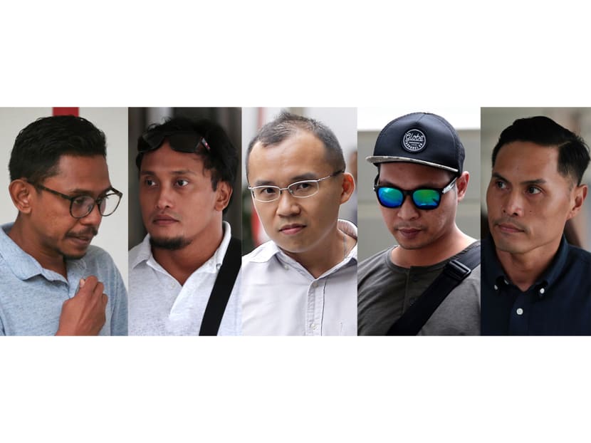 (From left) Mohamed Farid Mohd Saleh, Muhammad Nur Fatwa Mahmood, Chong Chee Boon Kenneth, Adighazali Suhaimi and Nazhan Mohamed Nazi were the five SCDF personnel charged in the District Court on Wednesday (July 25) with offences relating to the ragging incident that led to the death of a full-time national serviceman.