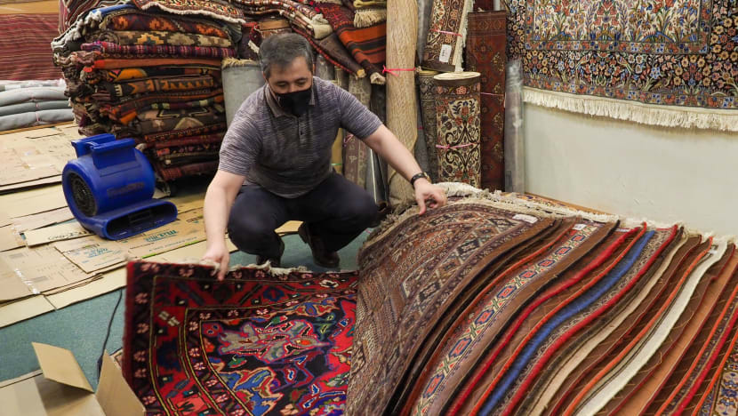 Record rains lead to flooding in Bukit Timah Plaza, causing some damage to shops and goods