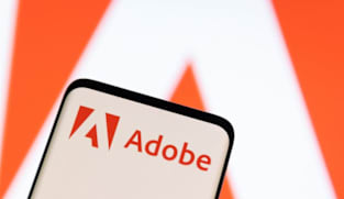 Adobe raises annual revenue forecast, CFO to exit 