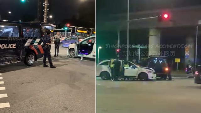 警车和轿车相撞 女司机正在助查