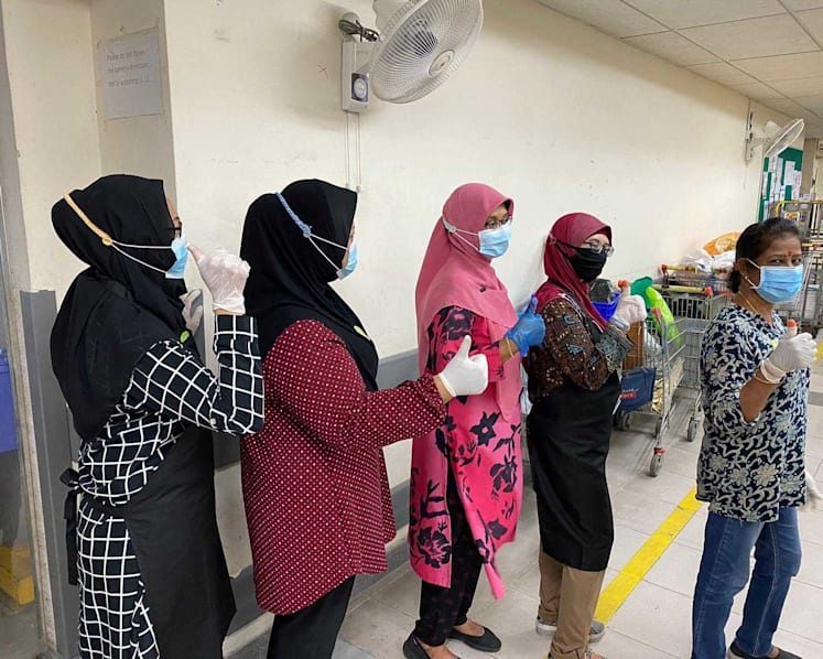 Heroes Unmasked: She knits extensions for face-mask straps for her tudung-wearing colleagues, front-line workers