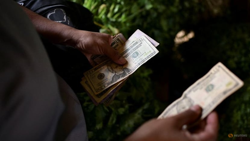 Dollar scarcity in Venezuela forces small firms to raise prices, turn to crypto