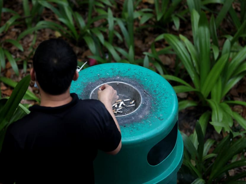 File photo of a man putting out a cigarette. File photo of a man putting out a cigarette.