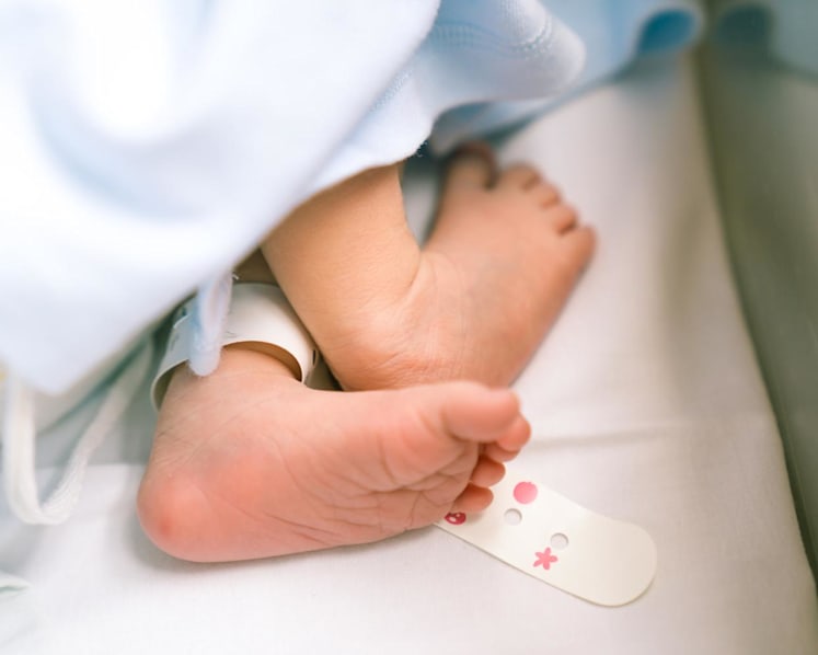 Coroner opens inquiry into death of one-month-old baby who was sleeping with mother