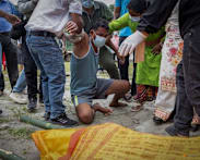 Nepali families hold symbolic funerals for missing after floods