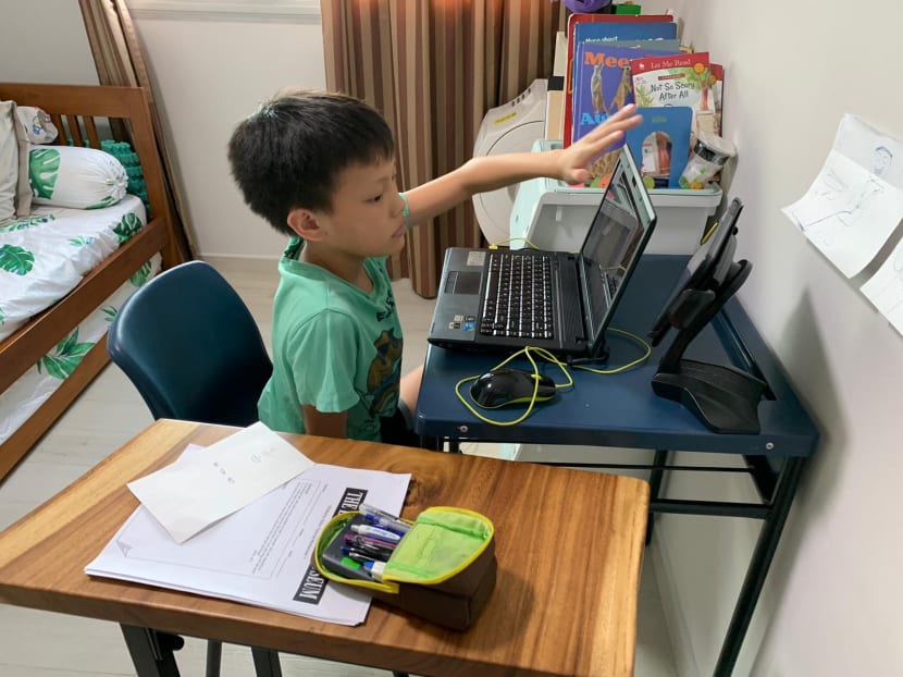 Primary 5 student Bryan Sng is seen working on his home-based learning assignments on March 31, 2020.