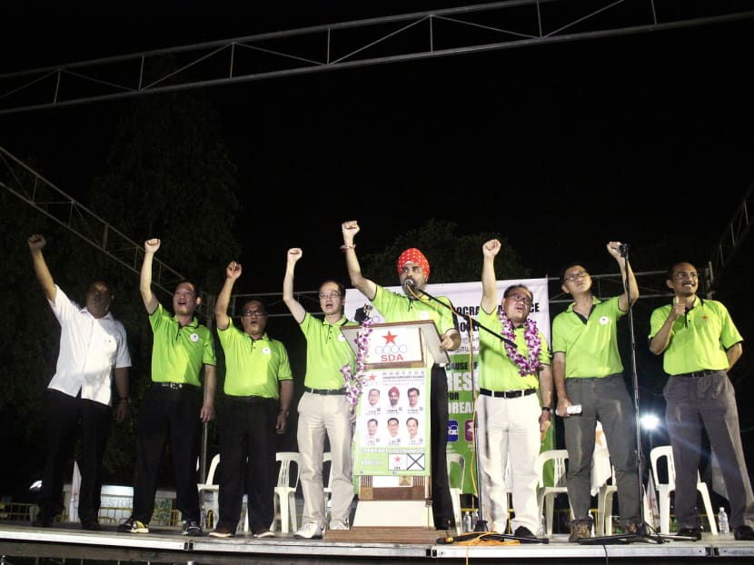 (From left) The SDA’s Mr Ismail Yaacob, Mr Ong Teik Seng, Mr Abu Mohamed, Mr Arthero Lim, Mr Harminder Pal Singh, Mr Desmond Lim and Mr Sunny Wong at yesterday’s rally at Pasir Ris Park. Photo: Daryl Kang