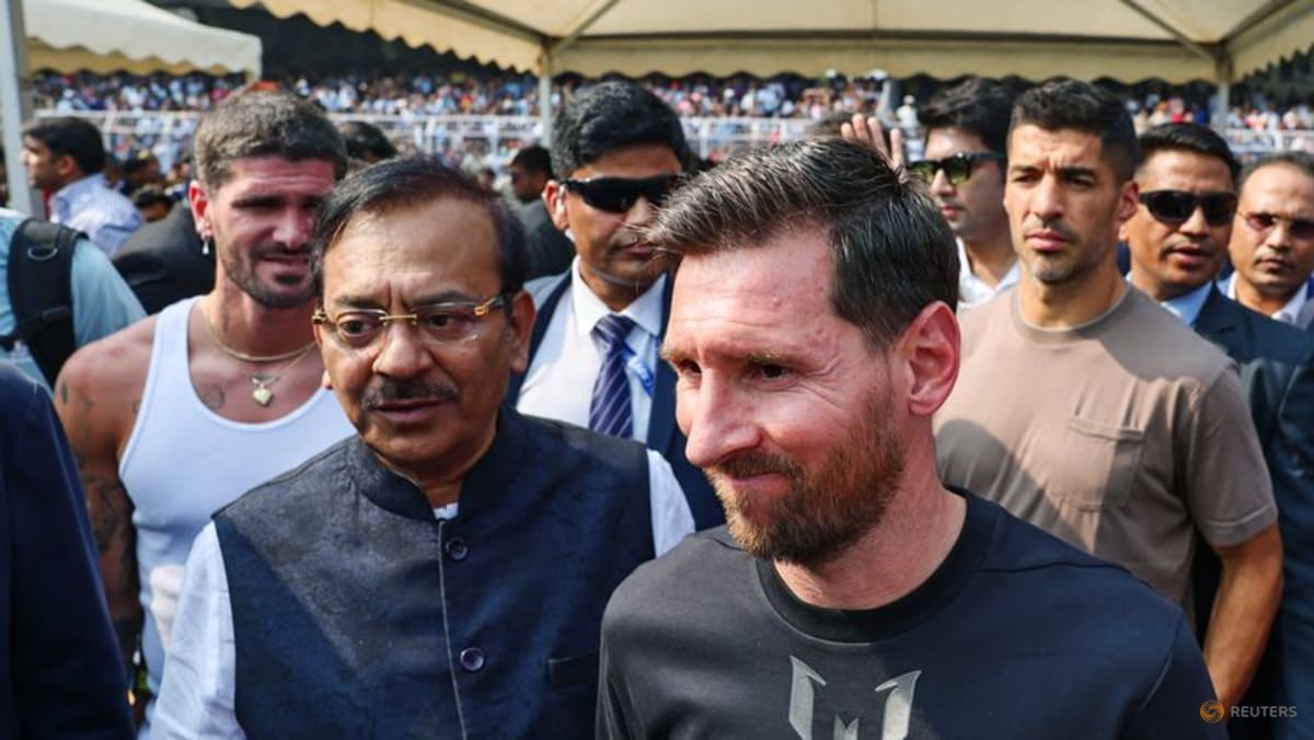 India fans throw objects onto field after Messi makes brief visit