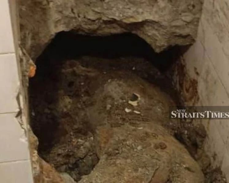 M'sian police make arrest, launch manhunt after woman's body found encased in cement