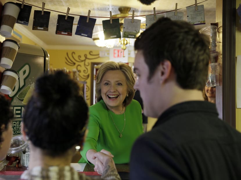 In this photo, April 14, 2015, Democratic presidential candidate Mrs Hillary Rodham Clinton meets with local residents at the Jones St Java House in LeClaire, Iowa. Photo: AP