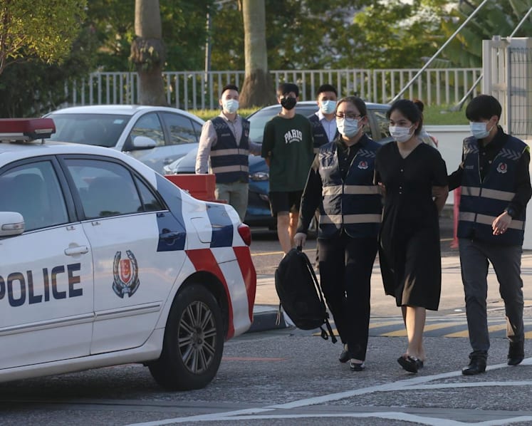Luxury goods scam: Fugitive couple arrested in Johor Bahru, brought back to Singapore