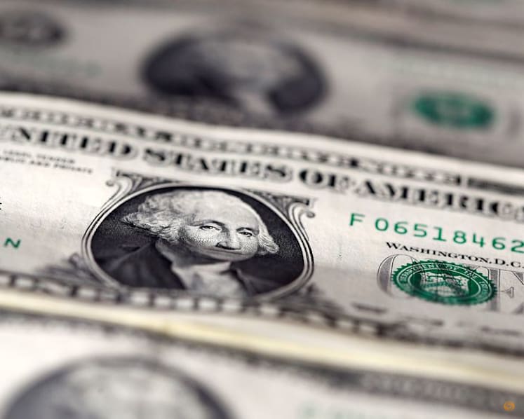 US dollar sinks to four-year low as Trump brushes off the decline