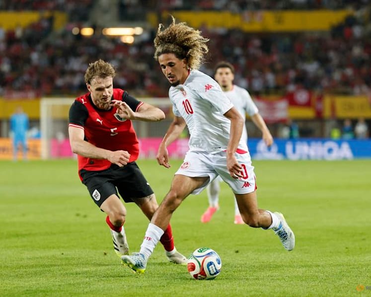 Austria fight back from early red card to beat Tunisia