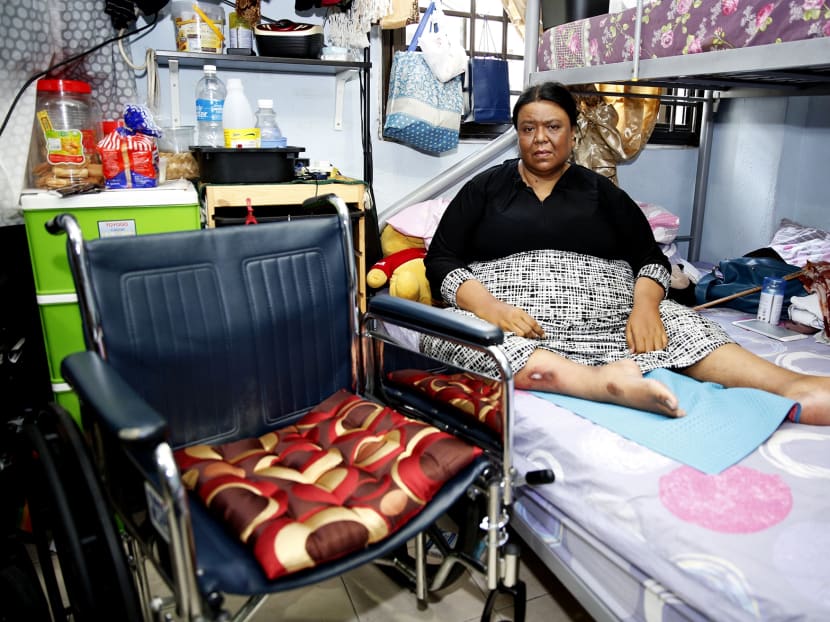 Ms Puspawati Abdul Razat, who is wheelchairbound, in her one-room flat in
Telok Blangah Crescent. She was dissuaded by the couple from calling an ambulance for Daniel, but managed to do so with her niece’s help. Photo: Damien Teo/TODAY
